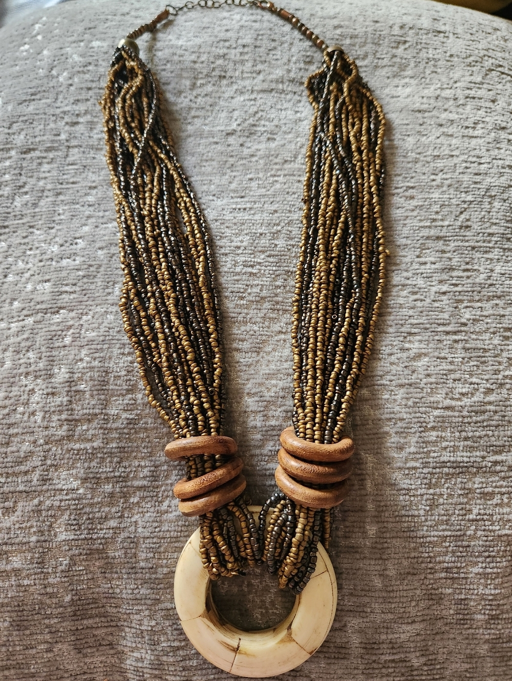 Multi-Strand Bead Necklace with Cream Pendant